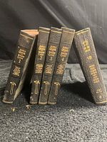 Spine view of all five Audels volumes standing to show titles and condition