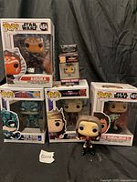 Front group shot showing all six Funko Pop items with boxes and loose figure
