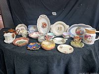 Front view of all seventeen porcelain and ceramic pieces on display