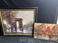 Both paintings: framed arch scene and unframed Moulin Rouge scene