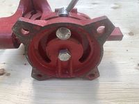 bottom view showing four-bolt swivel base and red paint