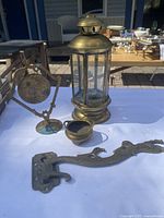 All five brass items displayed on table