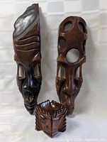 Front view of two masks and face vessel