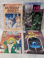 Front view showing all four bagged comic books