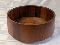 Overhead view of teak bowl showing interior grain and circular form