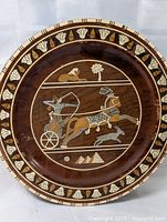 Front view of wooden wall plate showing full design