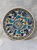 Front view of entire 12" hand-painted ceramic plate