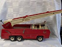 Left side view showing entire Tonka fire truck with ladder extended