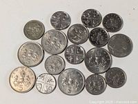 All 19 English 5 pence coins laid out showing obverse & reverse variety
