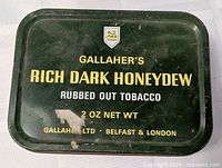Top view of Gallaher’s Rich Dark Honeydew tobacco tin showing full text and crest
