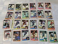Front view showing 25 laid-out cards from the 1983-84 O-Pee-Chee set