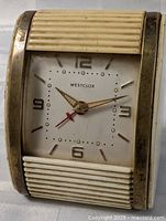 Front view of Westclox rectangular off-white mantel clock showing dial and ribbed panels