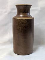 Front view of brown stoneware bottle