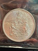 Reverse side showing CANADA 1965 50 CENTS and coat of arms