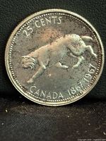 Reverse side showing bobcat and inscriptions 25 Cents Canada 1867-1967