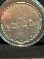 Voyageur reverse showing canoe and date 1968