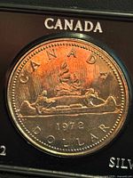 Reverse of 1972 Canada silver dollar in holder