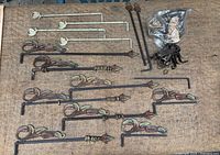 Overview of all curtain rods and hardware on burlap surface