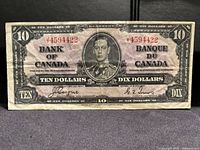 Obverse of 1937 $10 note showing serial number, portrait, signatures