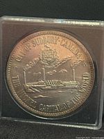 Obverse of token showing Sudbury smelter and legend