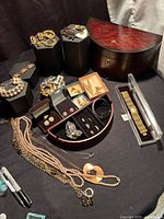 Overview of jewellery box and assorted necklaces, bracelets, earrings and rings