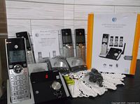 Full set with four handsets, main base, chargers, adapters, manual, box