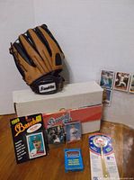 Group shot showing glove, storage box, sealed Red Sox set, trivia deck, packaged item and plastic card cases