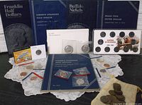 Overview of all items including Whitman folders, 1976 set, Kennedy halves, steel cent, wheat cents bag