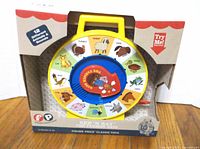 Front of boxed Fisher-Price See ’n Say showing toy and packaging details