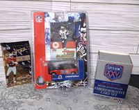 Group shot showing SkyBox pack, Drew Bledsoe blister pack, Super Bowl XXV box
