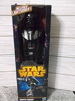 Front view of boxed 12" Darth Vader figure