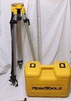 Tripod, grade rod and yellow RoboToolz carrying case