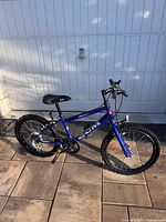 Right-side view of blue CCM youth bicycle