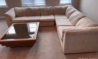 L-shaped beige sectional sofa front view