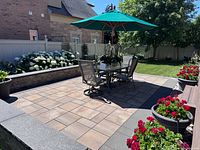 overview of Samsonite patio dining set including table and six chairs on patio