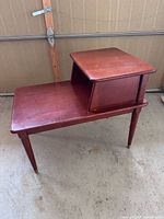 Perspective view of the stepped side table showing top and legs