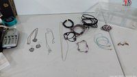 All jewellery pieces laid out with plastic case visible