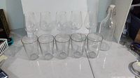 Group view of 5 wine glasses, 5 tumblers, 1 decanter