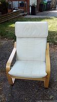 Front view of Ikea bentwood chair with white cushion