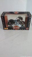 Front angle of boxed 1:18 scale Harley-Davidson FLHT Electra Glide model