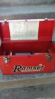 Exterior of red Ramset toolbox with lid open