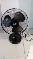 Front view of Comfort Zone black 14-inch table fan