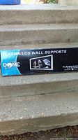 Front of retail box displaying Dome Plasma/LCD wall mount branding and product image