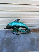 Full view of ceramic dolphin figurine
