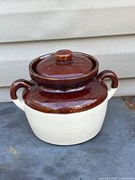 Front angle view of McCoy two-tone stoneware bean pot with lid