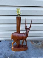 Full view of teak gazelle lamp with socket