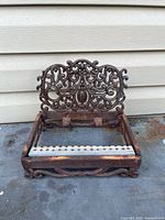 Full view of ornate cast iron boot scraper frame
