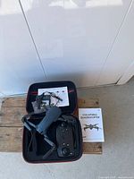 Drone, remote, battery, cable and case overview
