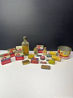 Group shot of all vintage spice, medicine tins, bottle and chili can