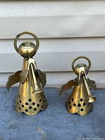 Both brass angel candle holders front view